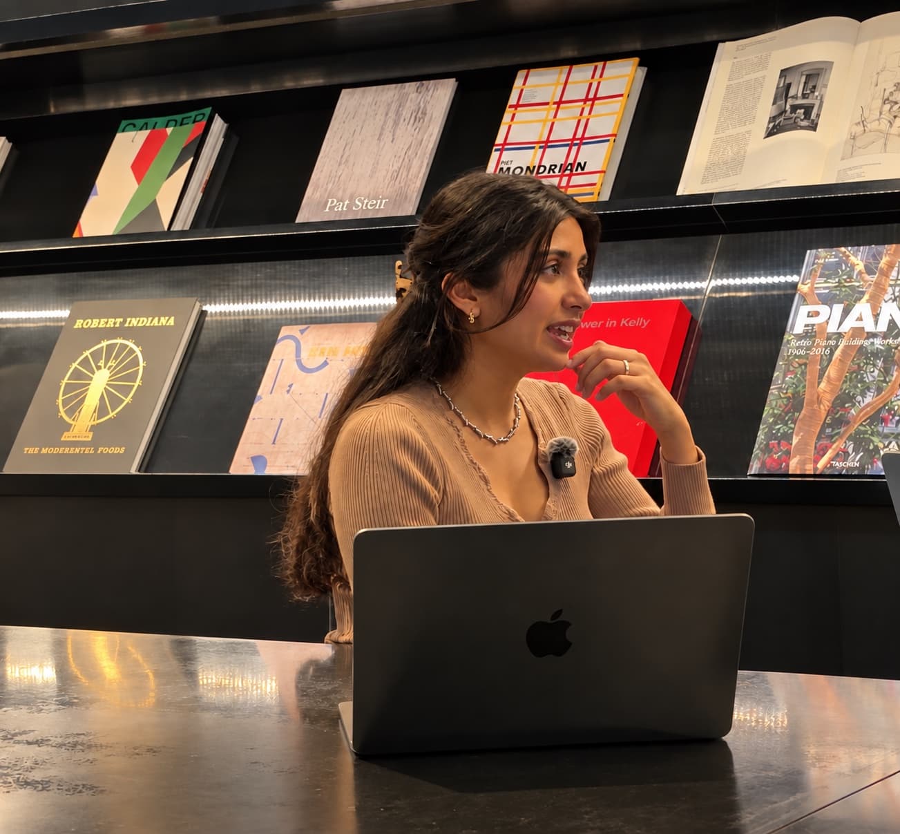 Deeya Kotecha recording the podcast, wearing a lavalier microphone.